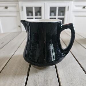Vintage Shenango china 642" creamer with a white interior.